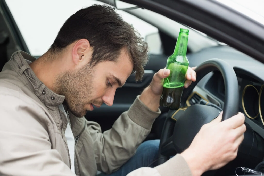 man drinking while driving- what are wet reckless driving charges